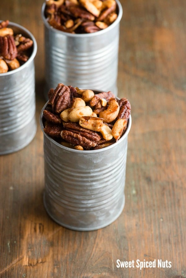 Sweet and spicy candied cashews and pecans in Sweet Spiced Nuts, in galvanized cans