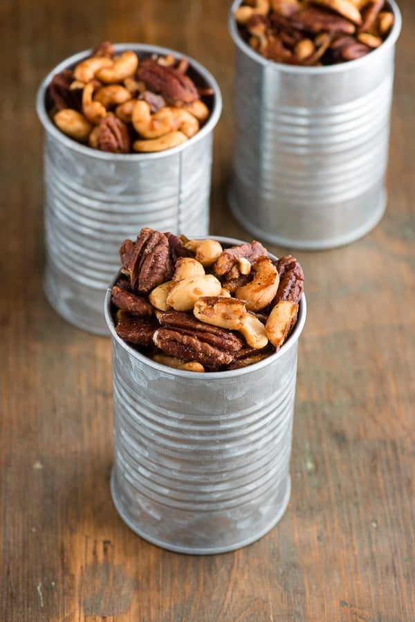 Sweet Spiced Nuts are candied cashews and pecans that are spicy and sweet, in galvanized cans 