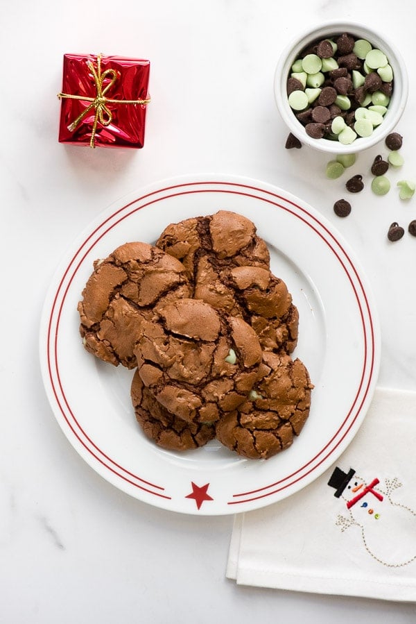 Chocolate Mint Truffle Cookies on a red rimmed white plate with snowman napkin