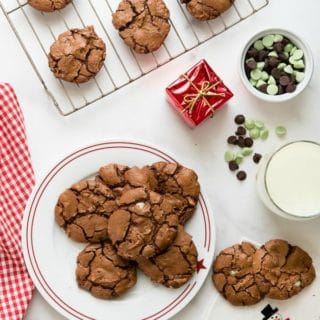 Chewy rich Chocolate Mint Truffle Cookies on a white plate with red rim