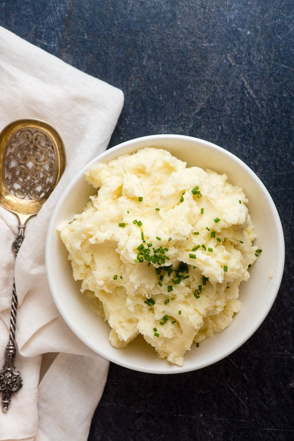Creamy Instant Pot Mashed Potatoes in a white bowl
