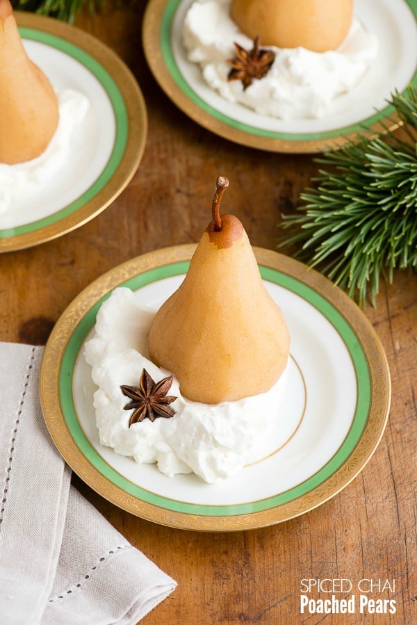 Spiced Chai Poached Pears in whipped cream on antique gold rimmed Haviland china dessert plates