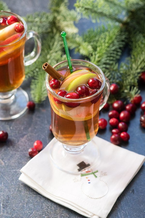 Cranberry Apple Hot Toddy in glass mug with cranberries