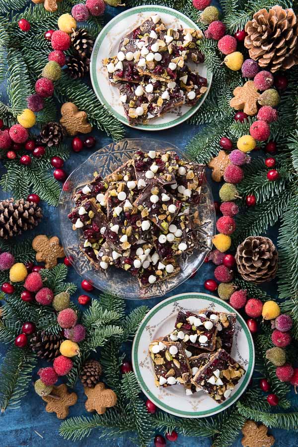 Three plates of Christmas Crack with toppings