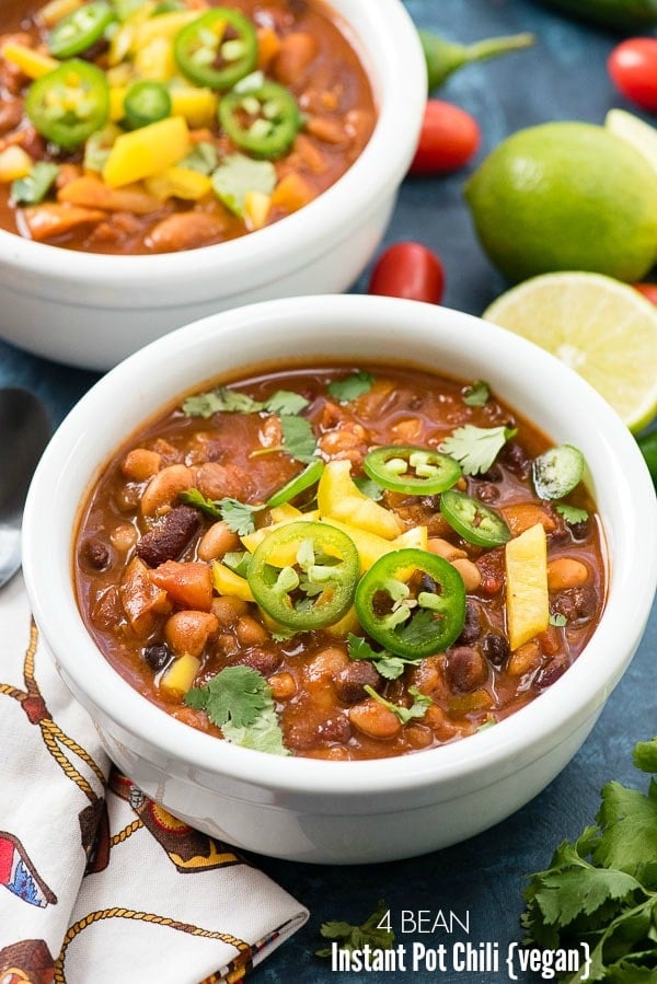 Vegan Instant Pot Recipe: 4 Bean Chili with jalapeno slices, diced yellow bell pepper in a white bowl