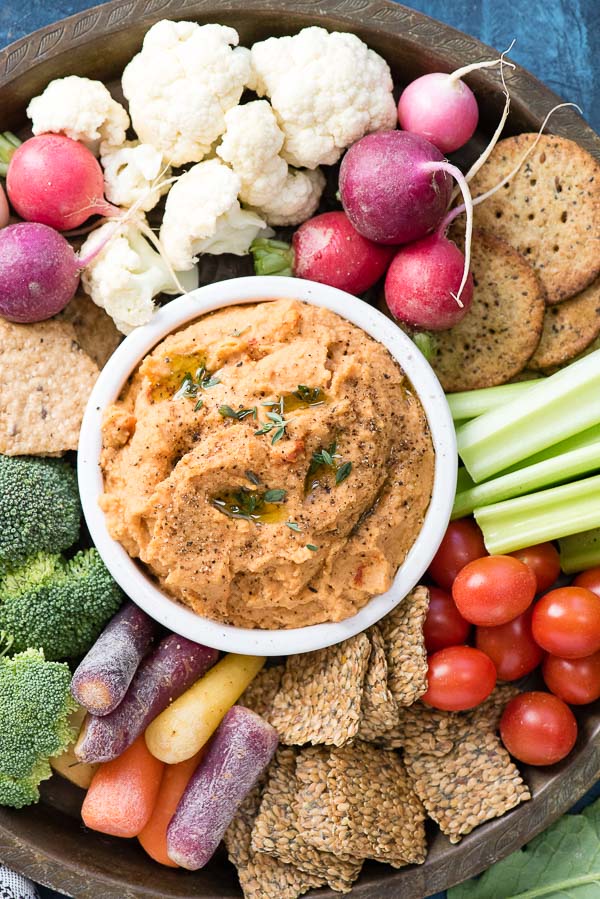 5-Minute Smoked Paprika Garlic Bean Dip with mixed vegetables and crackers