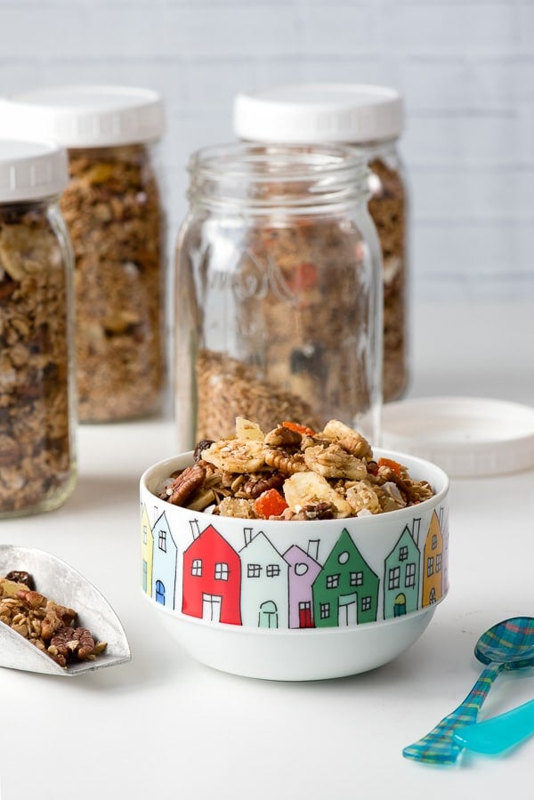 Gluten-free Slow Cooker Tropical Fruit Granola in bowl and jars