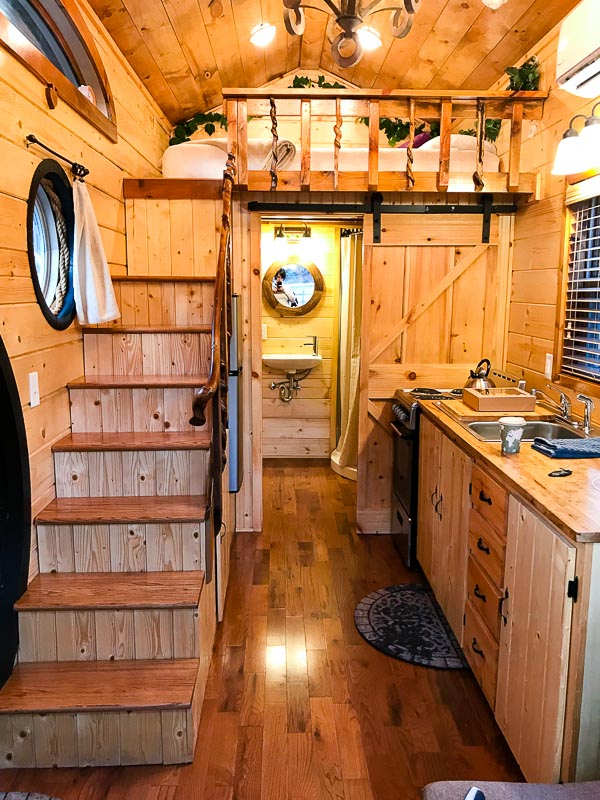 Hobbit House Tiny House kitchen, bathroom entrance and sleeping loft 