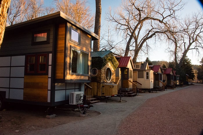 A row of Tiny Houses at WeeCasa Resort Lyons CO at sunrise