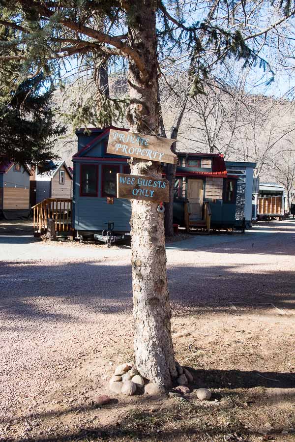 WeeCasa welcome sign nailed to pine tree