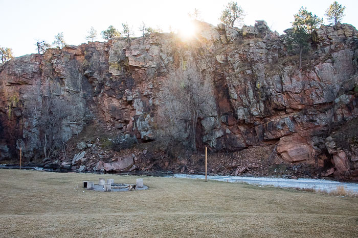 Sunrise over red rugges cliffs above river at WeeCasa Resort Lyons CO 