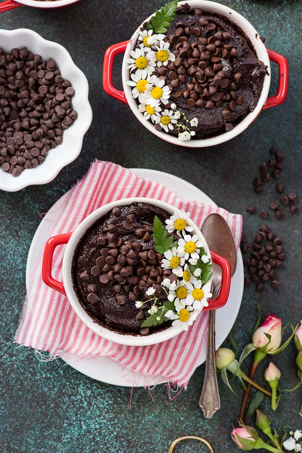Rich Chocolate Cherry Brownie pots with edible flowers and mini chocolate chips in red cocottes