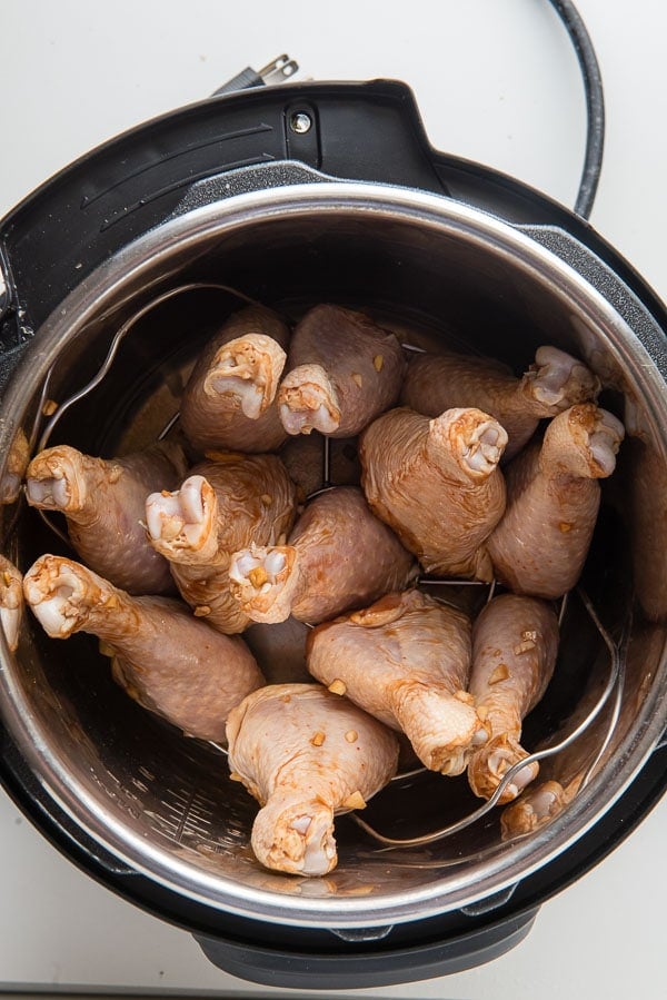 Instant Pot insert of marinated ginger soy chicken drumsticks