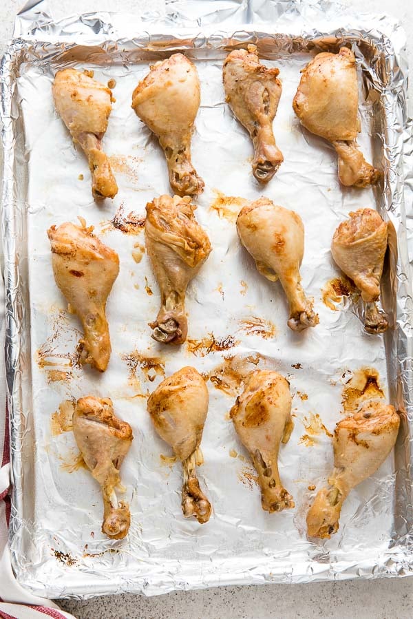 Baking sheet of broiled Instant Pot Ginger Soy Chicken Drumsticks