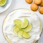 Instant Pot Lime Cheesecake with lime slices on top and gluten-free vanilla wafers