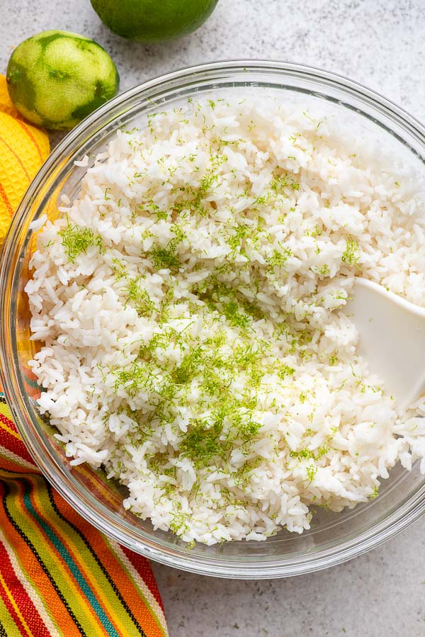 Freshly cooked Instant Pot long grain white rice with fresh lime zest in a clear glass bowl
