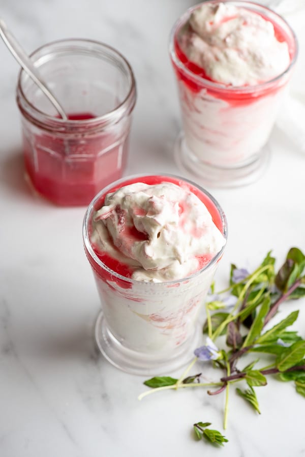 Two glasses of chilled, creamy Rhubarb Food dessert with fresh mint sprigs