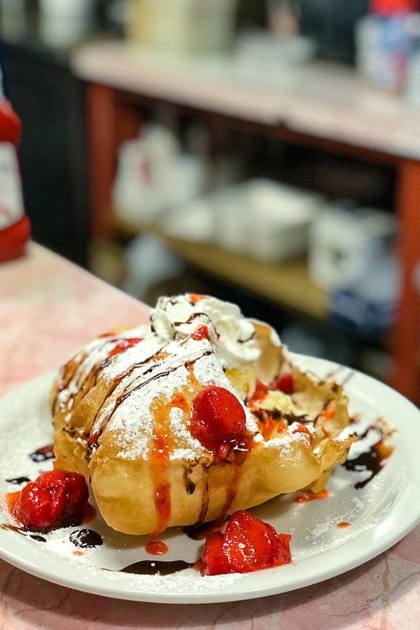 Stuffed dessert sopapilla with ice cream, chocolate, strawberries and powdered sugar (The Pantry Restaurant Santa Fe NM)