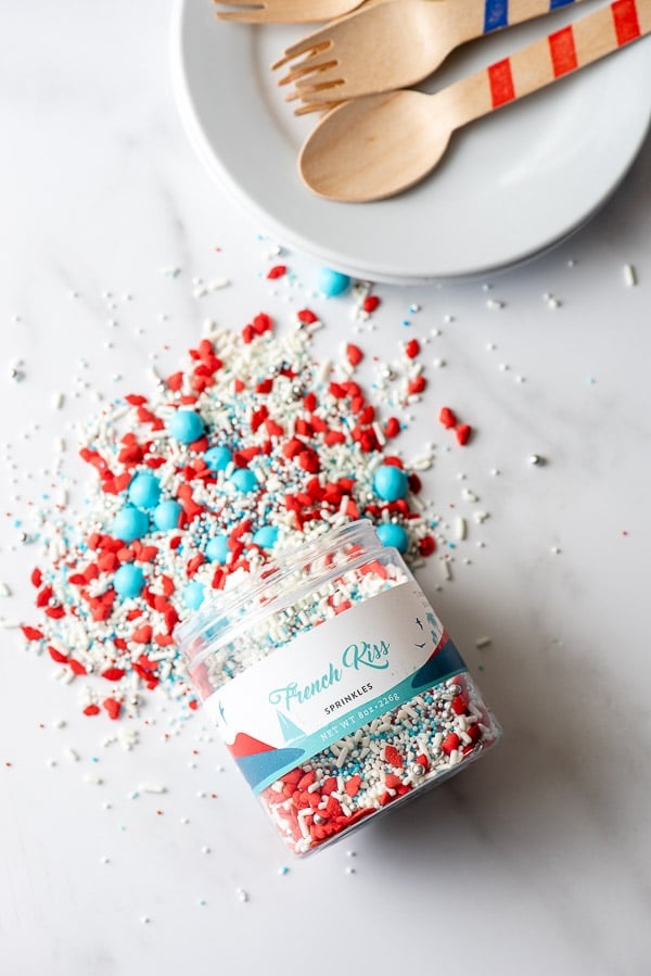 Red white and blue sprinkles spilled on a marble board