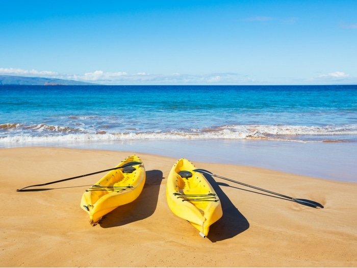 sea kayaks on a sunny beach