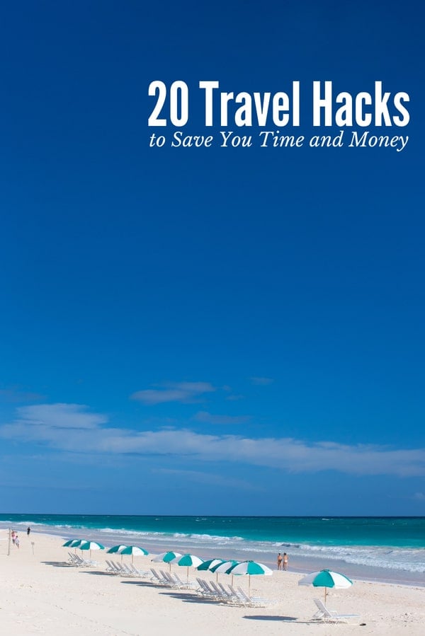 20 Travel Hacks (titled photo) Blue and white beach umbrellas on sandy beach