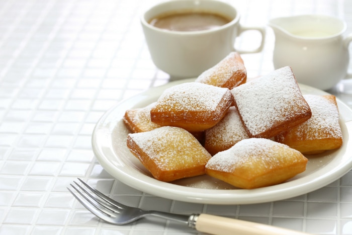 Beignets with cup of coffee