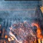 How to Grill Steak guide title (steak on grill)
