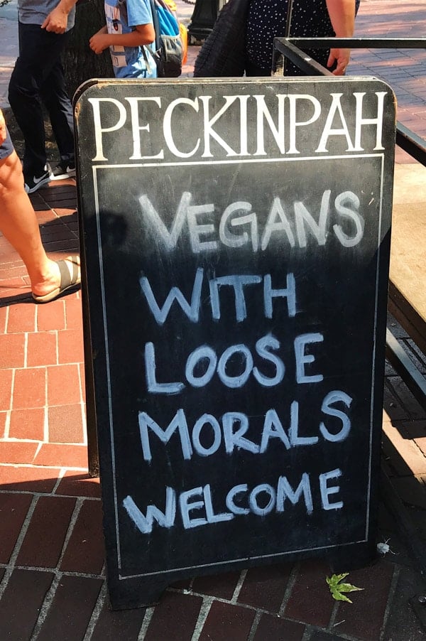 Cheeky restaurant sign in Gastown Vancouver