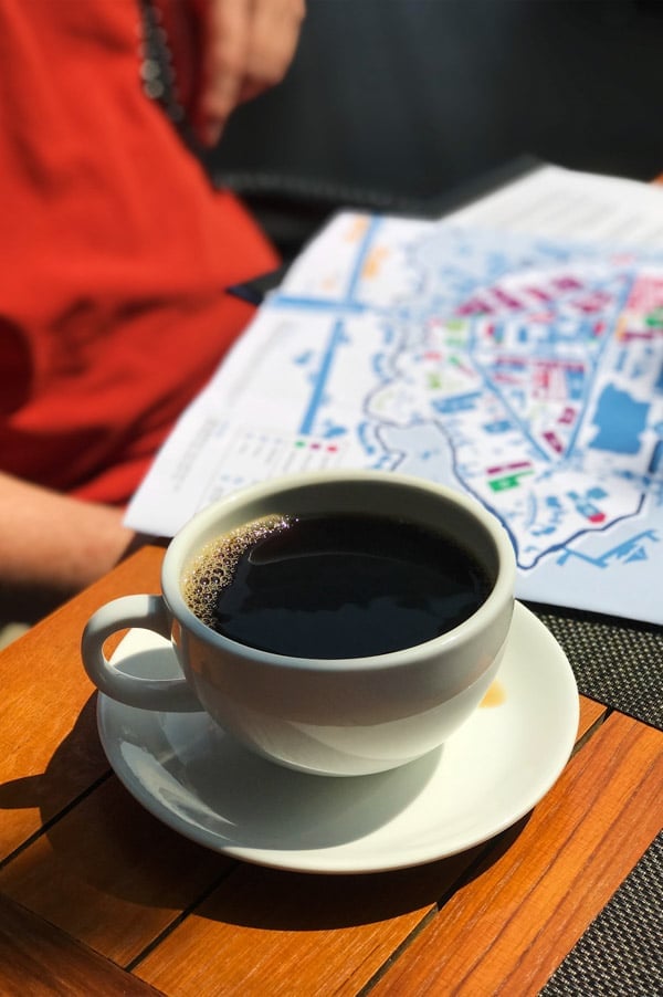 Cup of coffee and a map Things to do in Vancouver