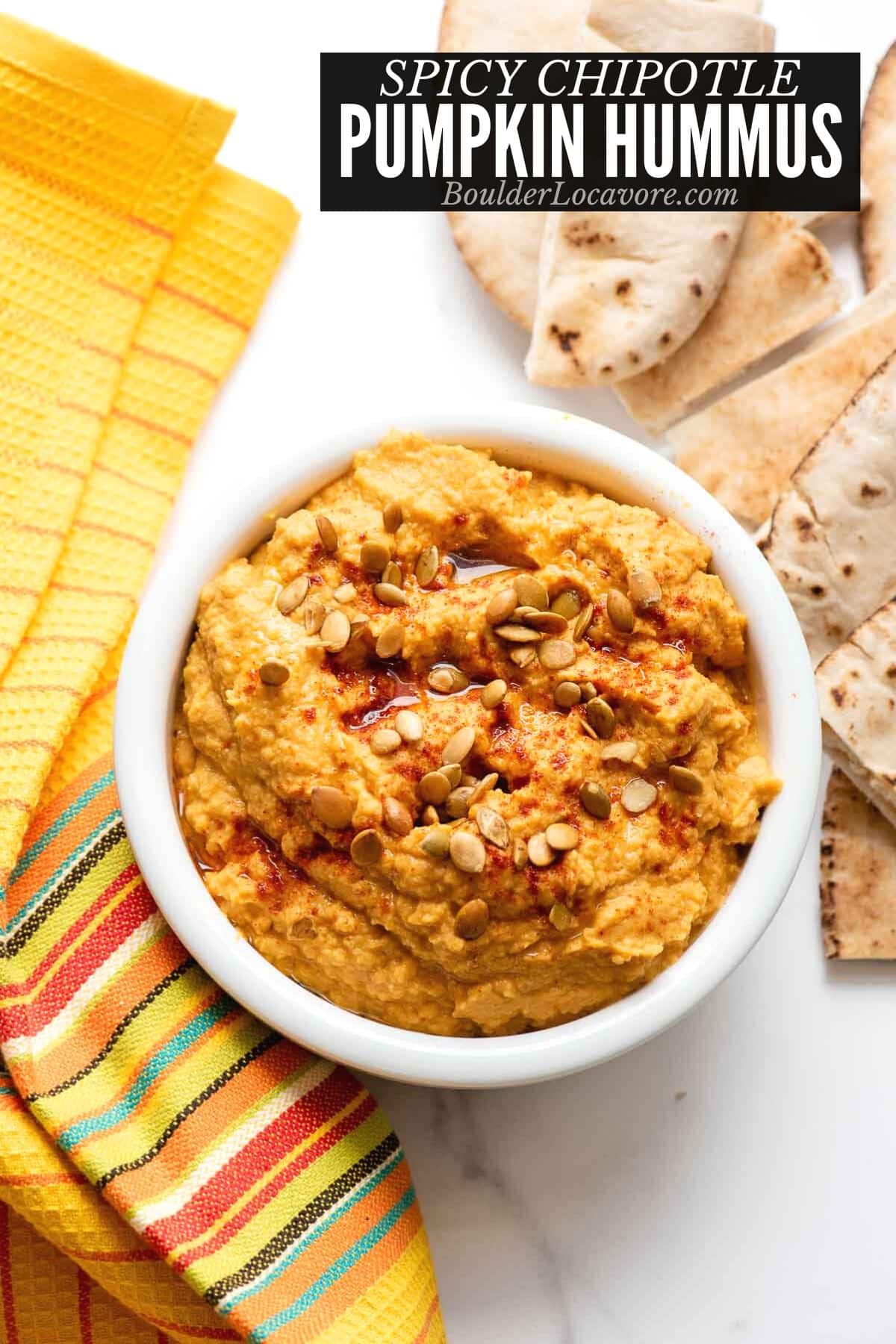 pumpkin hummus in white bowl.