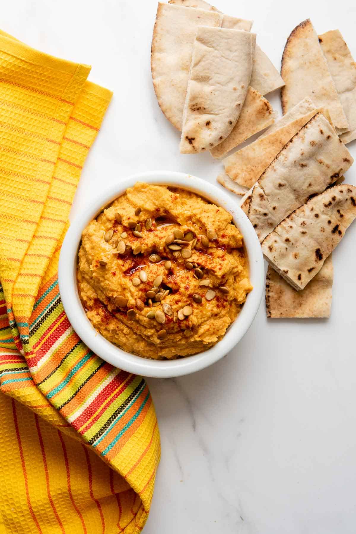 spicy pumpkin hummus with pita bread.