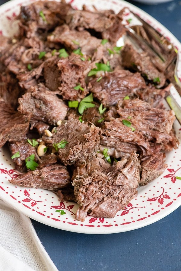 Instant Pot Pot Roast shredded on a platter