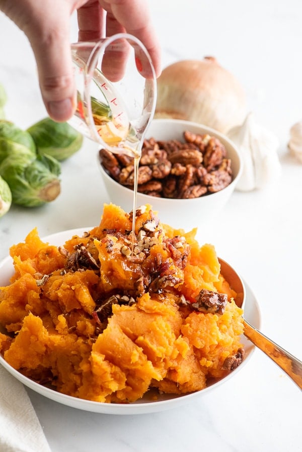 Mashed Sweet Potatoes with maple syrup drizzling on top