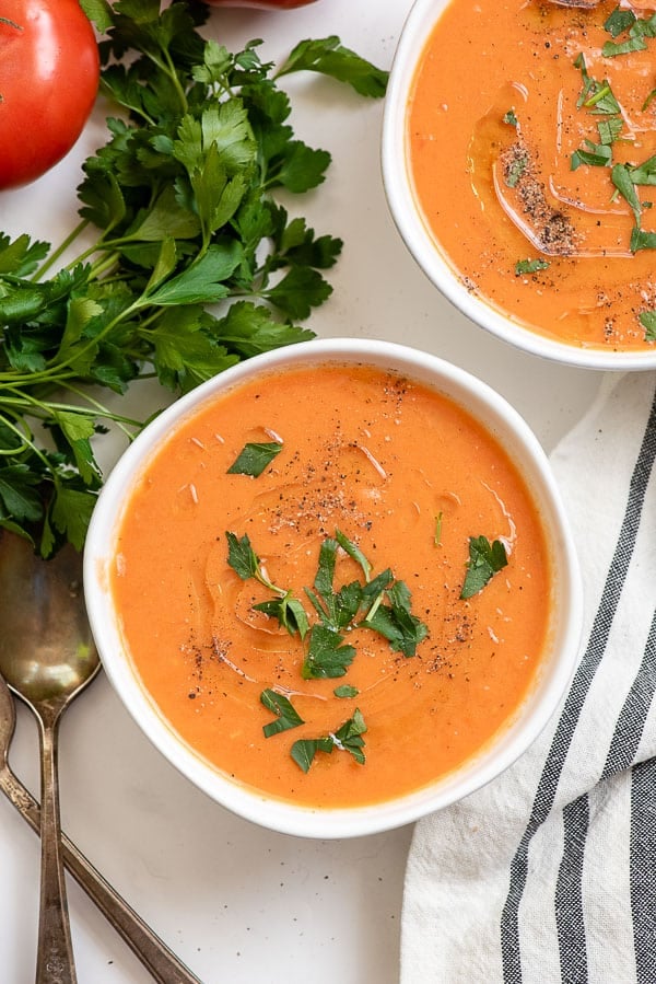homemade tomato soup in white bowl 2 servings