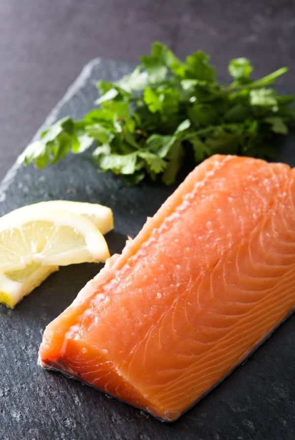 full salmon fillet with lemon and herbs