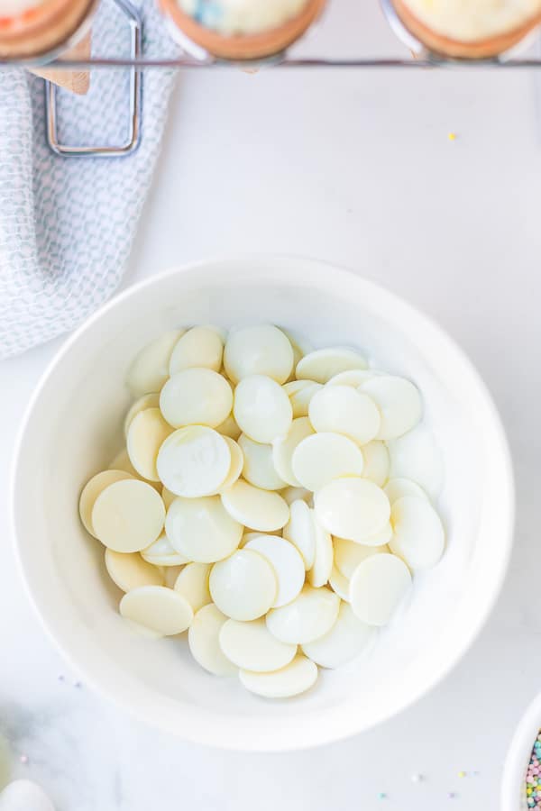 Vanilla Candy Melts in white bowl for Easter cupcakes