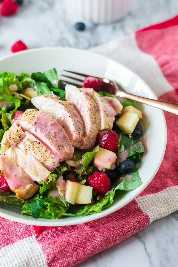 raspberry vinaigrette on salad with fork