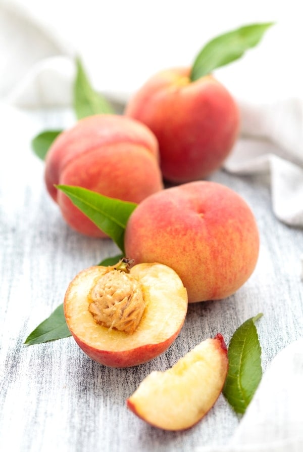 sliced peach with pit