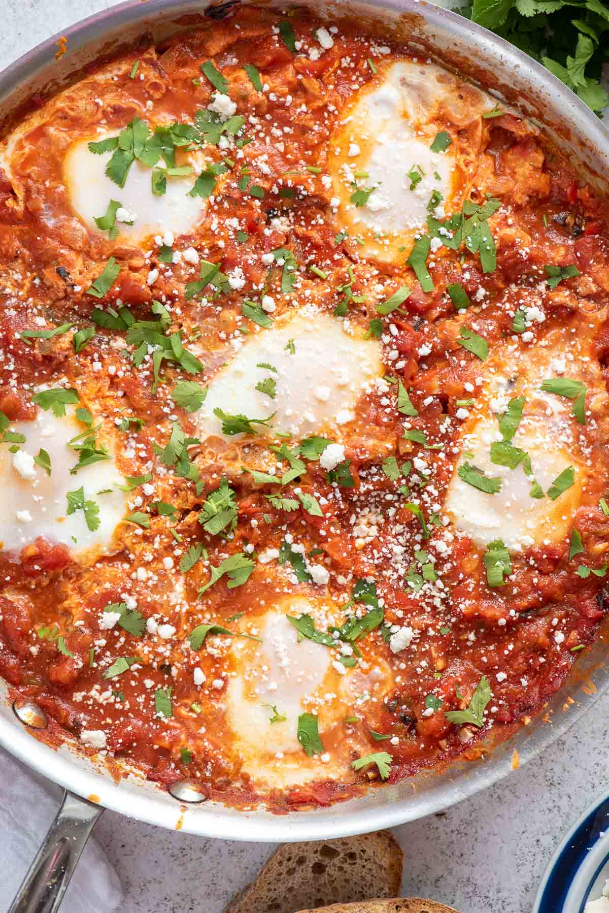 cooked shakshuka in skillet close up 