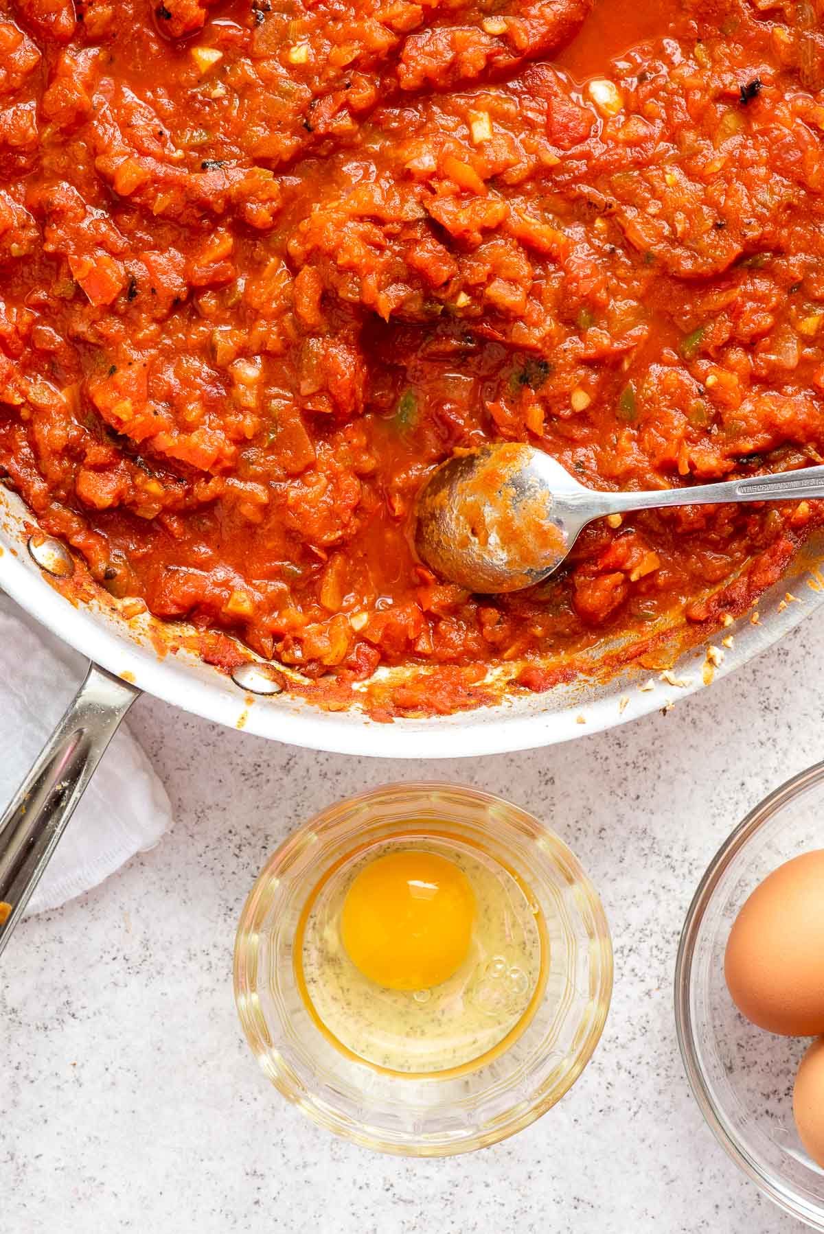 making space for cooking eggs in shakshuka
