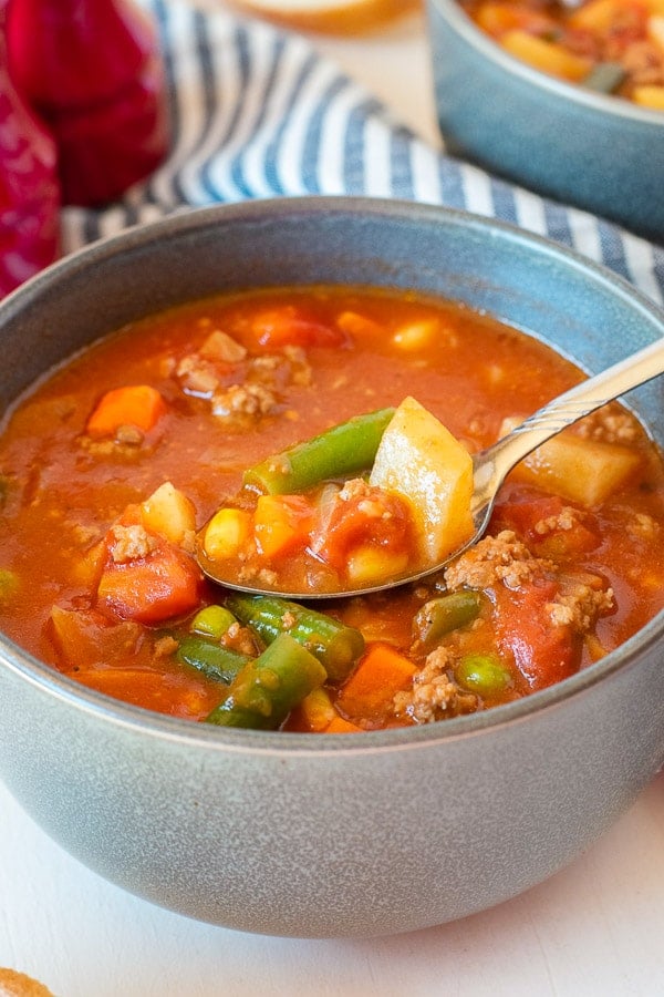 Vegetable Beef Soup in a bowl with spoon