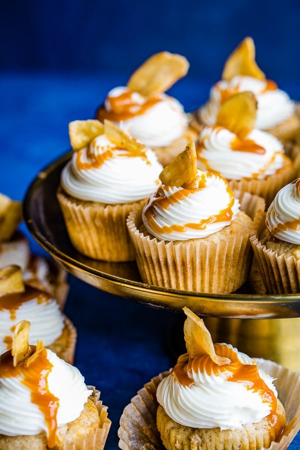 cupcakes with cream cheese buttercream frosting and caramel drizzle close up 