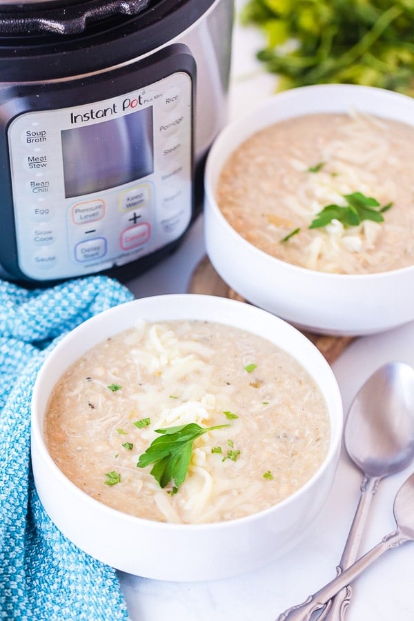 2 white bowls of white chicken chili made in the Instant Pot