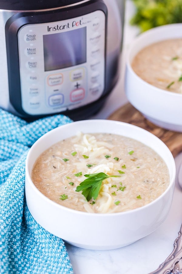 white bowl of Instant Pot White Chicken Chili with Instant Pot in background