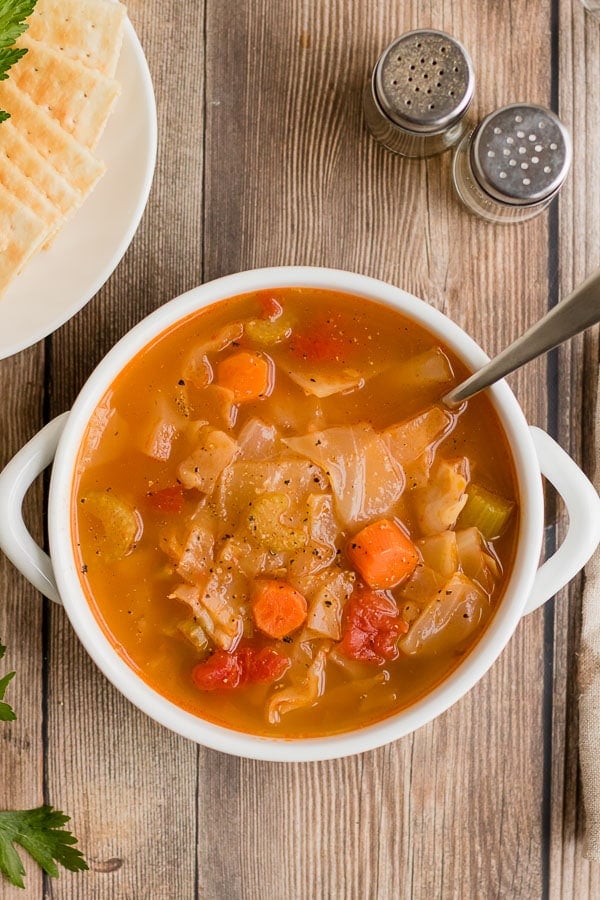 overhead white bowl of cabbage soup 