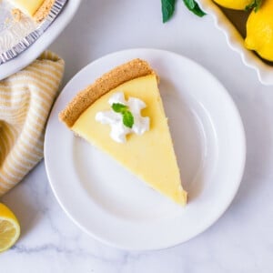 slice of no bake lemon pie on white plate crop.