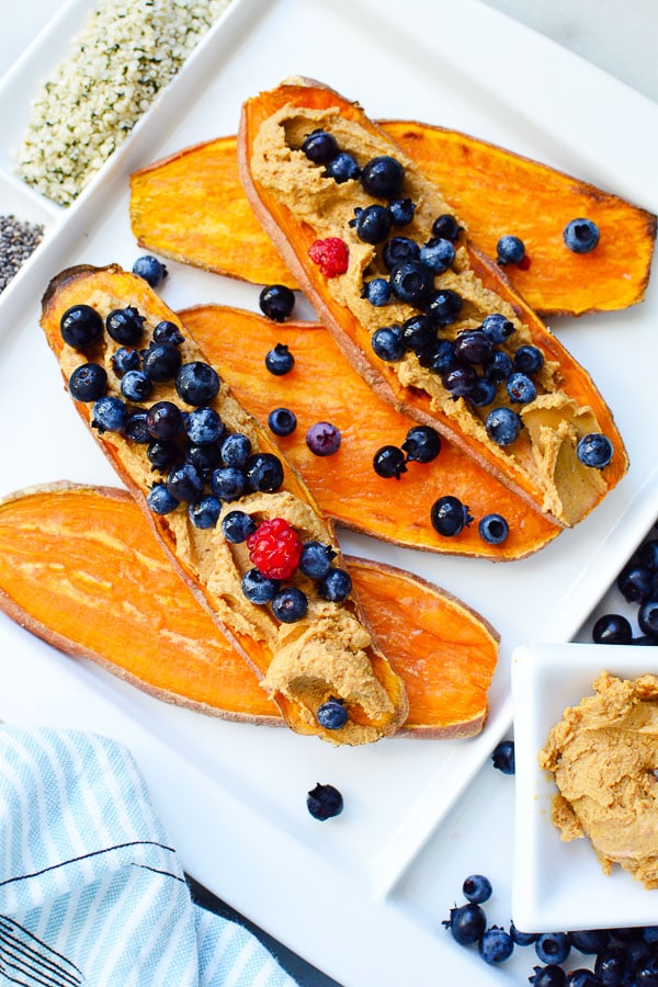 sliced sweet potato toast with nut butter and blueberries