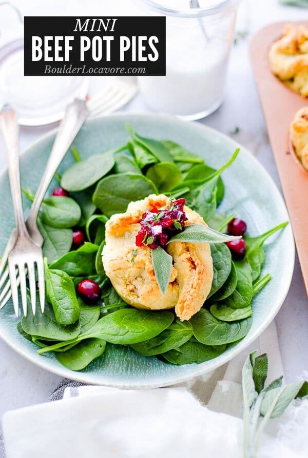 mini beef pot pies on spinach