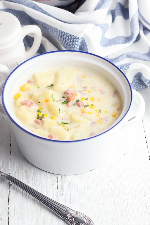 Bowl of potato corn chowder bowl with spoon