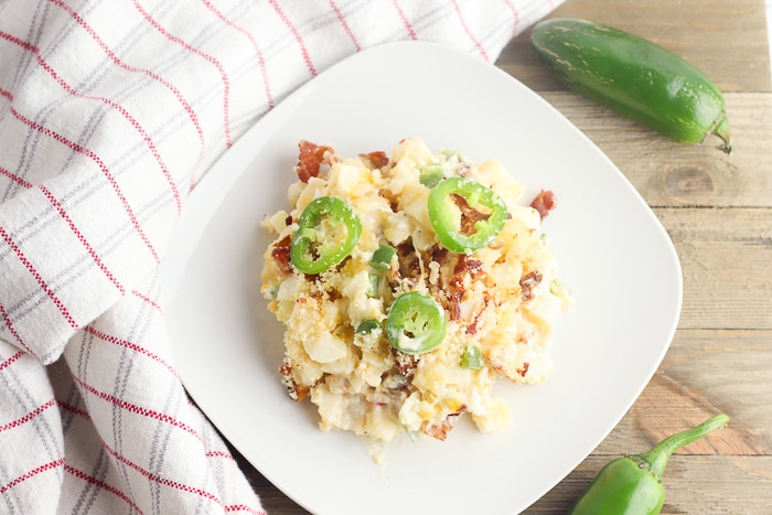 Jalapeno Popper Cheesy Potato recipe serving with a kitchen towel